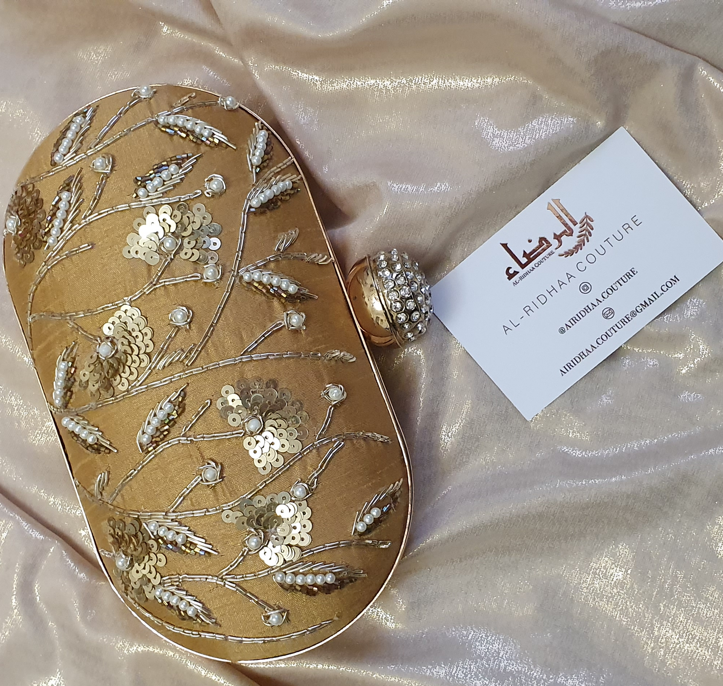 Small Oval Embroidered Clutch