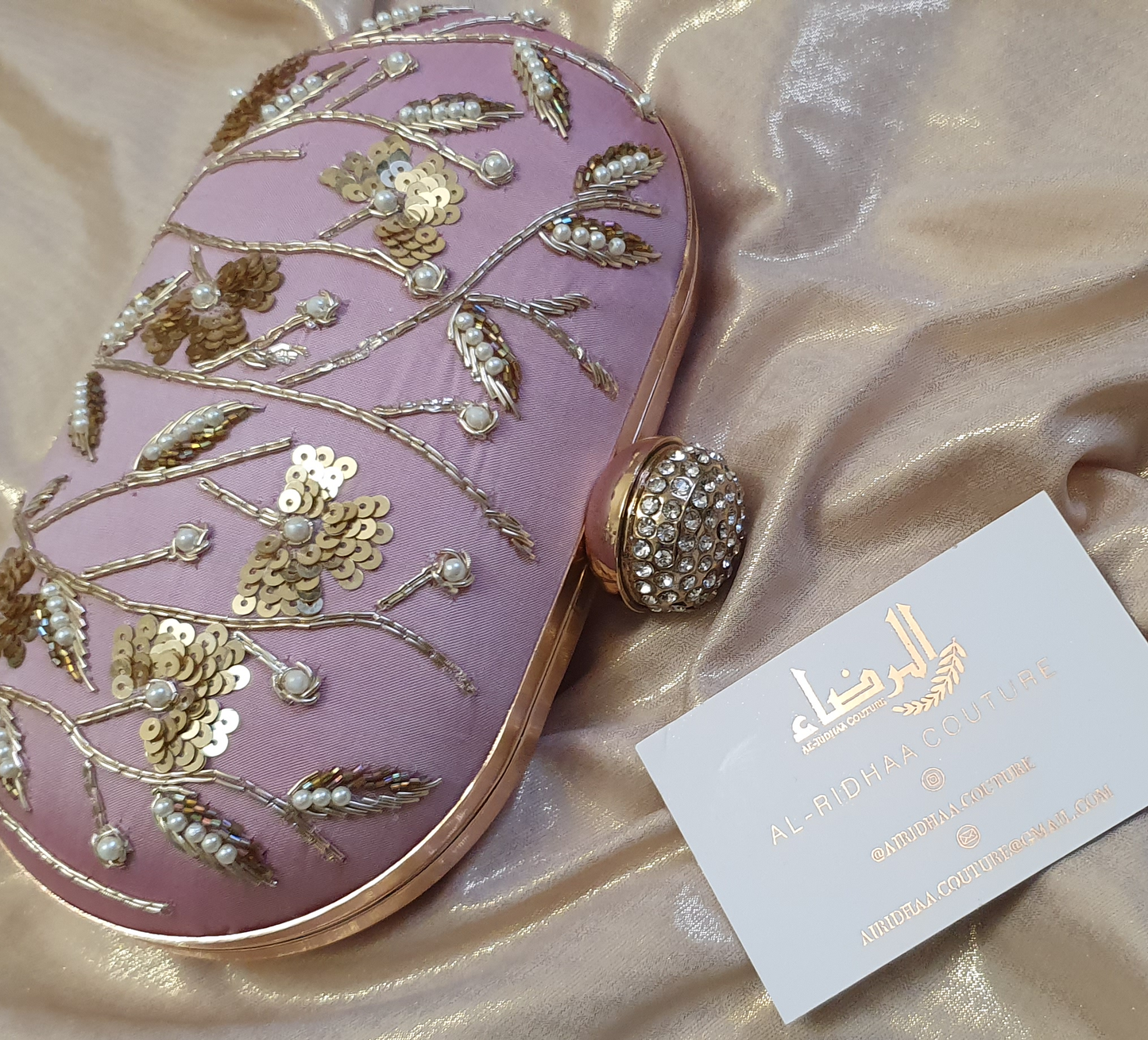Small Oval Embroidered Clutch