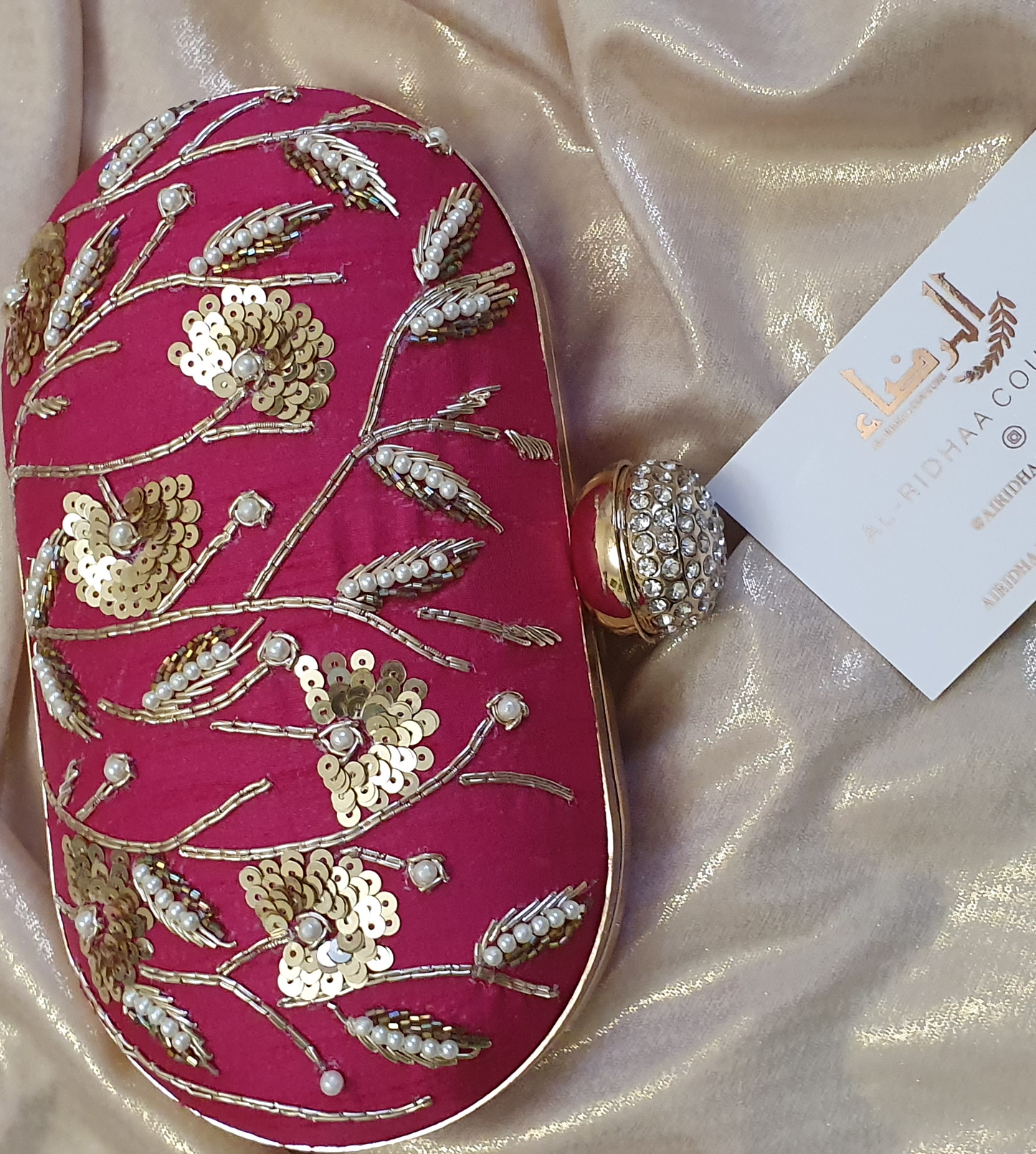 Small Oval Embroidered Clutch