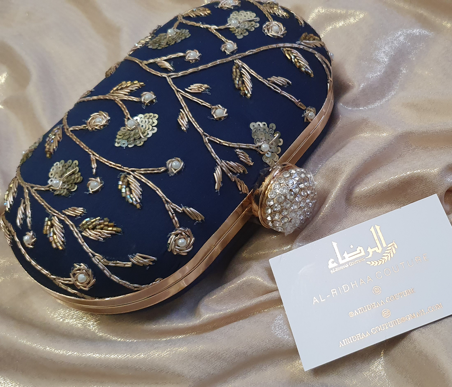 Small Oval Embroidered Clutch